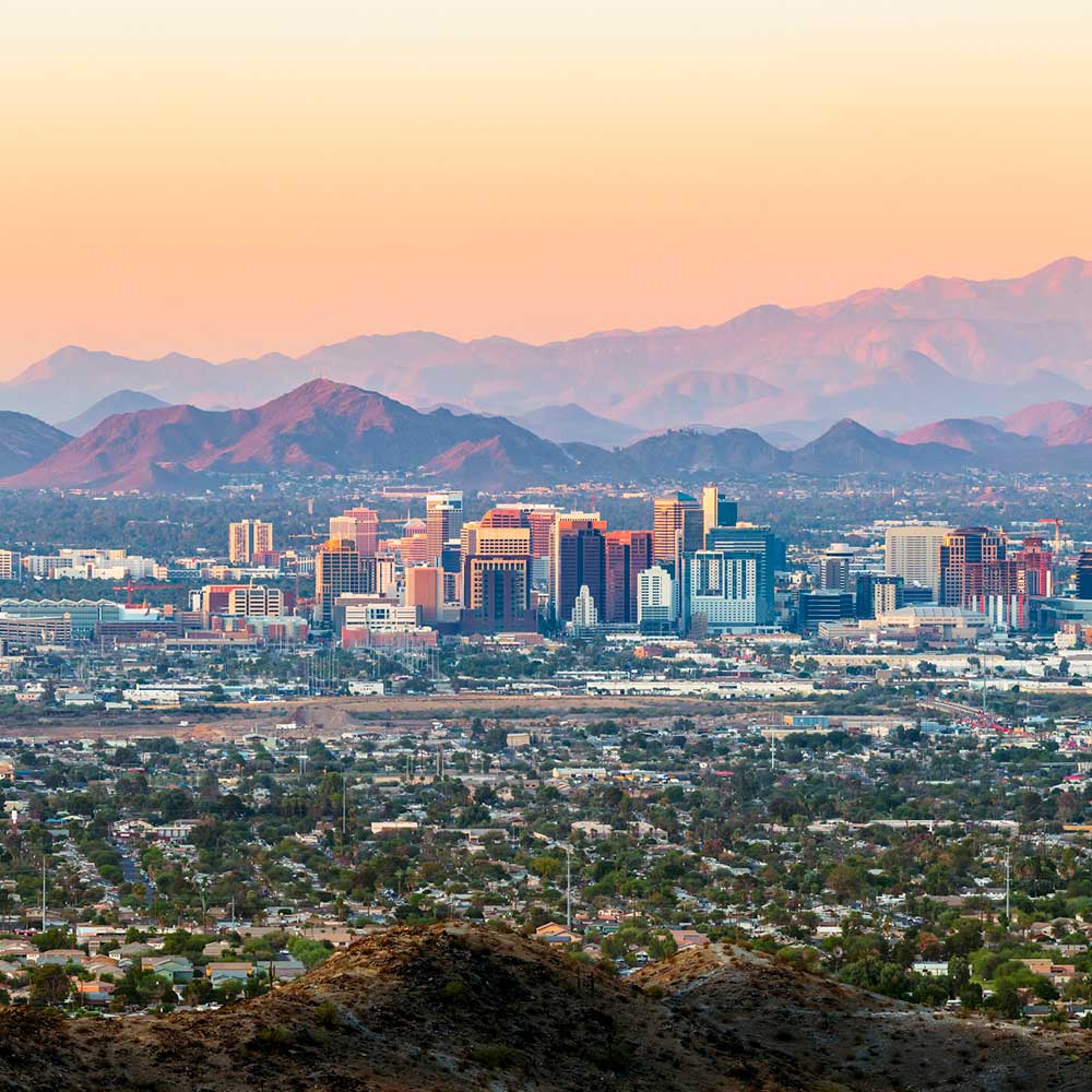Sunset over an Arizona city skyline